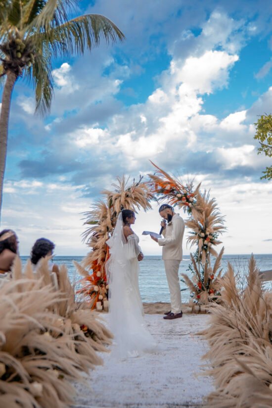 A visible couple pronouncing their vows at Marquis Paradise at a Wedding